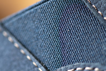 Fragment of men's moccasins made of blue leather close-up. There is artistic blur and artistic...