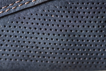 Fragment of men's moccasins made of blue leather close-up. There is artistic blur and artistic noise.の写真素材