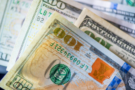 A scattered bundle of hundred dollar bills.