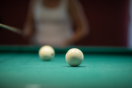 Beautiful green billiard table and balls for playing billiards.