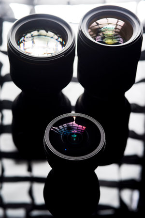 The camera lens photographed close-up on a dark background.