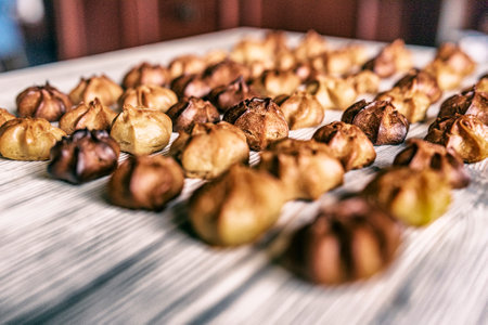 Choux pastry on a wooden background. Photographed in high key, closeup.