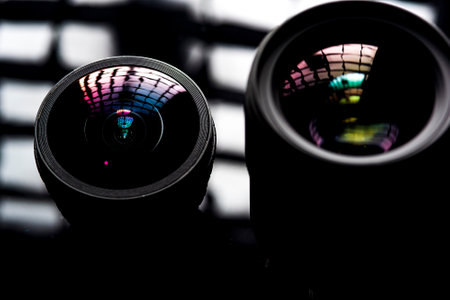 The camera lens photographed close-up on a dark background.の写真素材