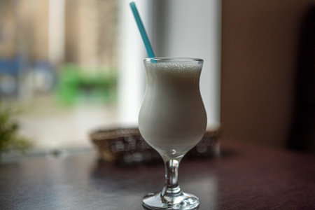Milkshake on a table in a cafe. Photographed close-up.の写真素材