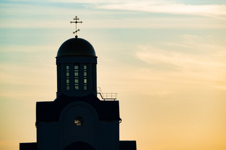 Church silhouette on a summer sunset background.の写真素材
