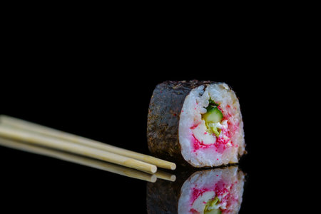 Sushi roll isolated on a dark background.の写真素材