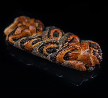 Pie with poppy seeds on a dark background.の写真素材