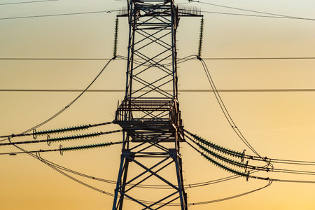 High voltage power line at sunset.の写真素材