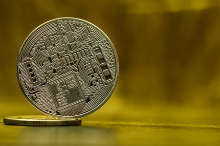 Bitcoin closeup on a golden background.