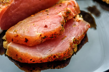 salted pork tenderloin on a plate close upの写真素材