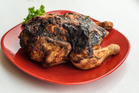grilled chicken on a red plateの写真素材