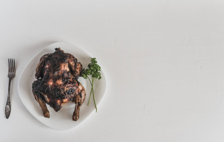 fried chicken on a plate on a light backgroundの写真素材