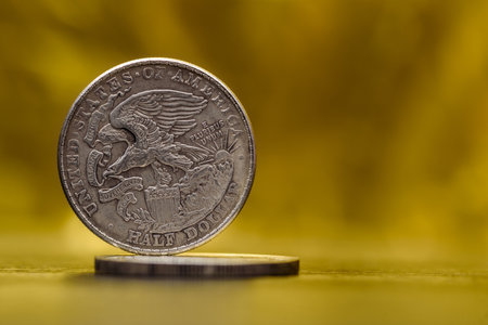 American coins on a golden background.の写真素材