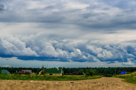 storm clouds over the meadowの写真素材