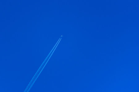 plane flying in the skyの写真素材