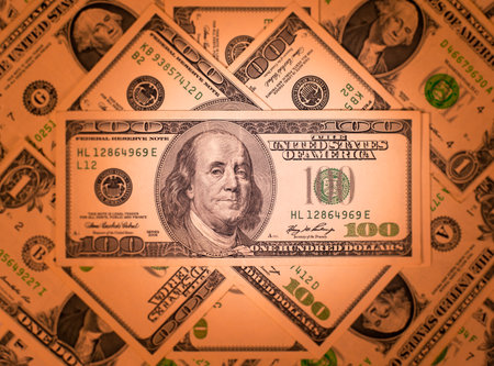 Dollars banknotes background. Shallow depth of field. Toned.の写真素材