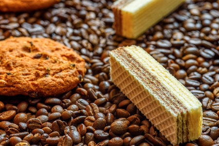 chocolate shortbread cookies on a background of coffee beansの写真素材