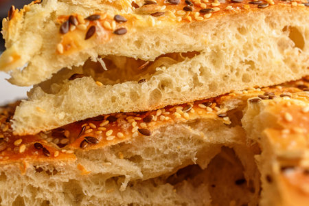 Close-up of a slice of bread with sesame seeds.の写真素材