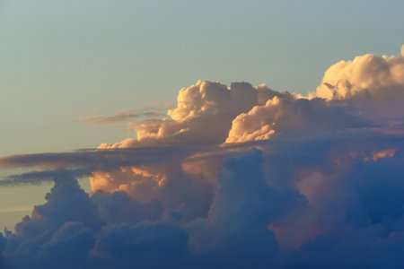 fluffy clouds against the skyの写真素材