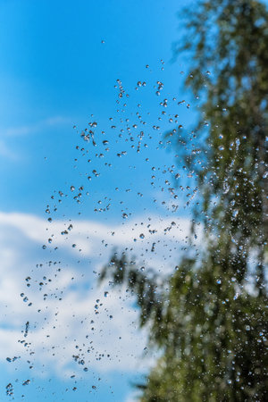 drops of a fountain against the skyの写真素材