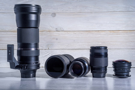 photographic lens on a white wooden backgroundの写真素材