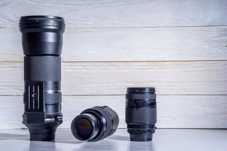 photographic lens on a white wooden backgroundの写真素材