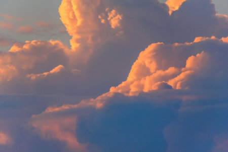 fluffy clouds against the skyの写真素材