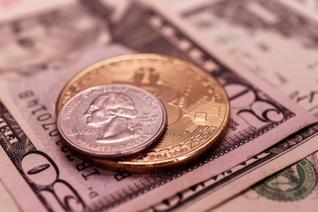 Dollars and one cent coin on the background of the dollarの写真素材
