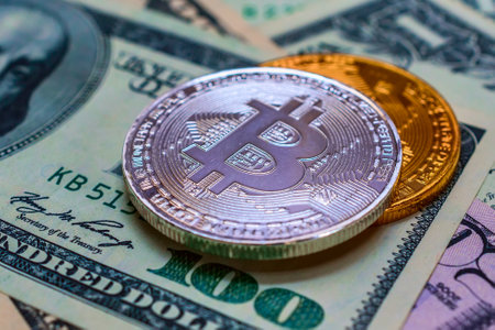 Bitcoin coin on the background of dollar bills. Digital currency. Cryptocurrency.の写真素材
