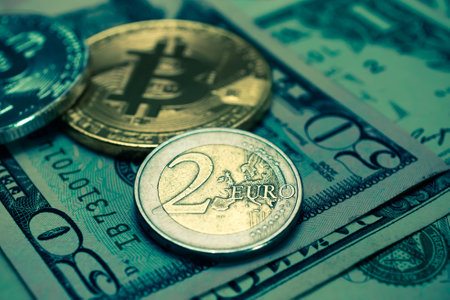 Coins on the background of one hundred dollar bills. Shallow depth of field. Toned.の写真素材