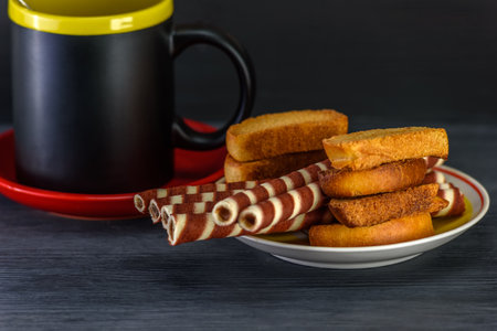 Crispy toasted bread sticks and a cup of tea.