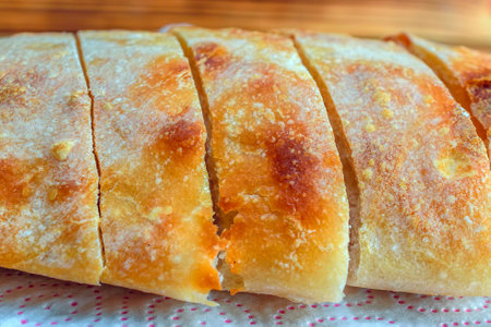 Slices of bread on a napkin on a wooden background