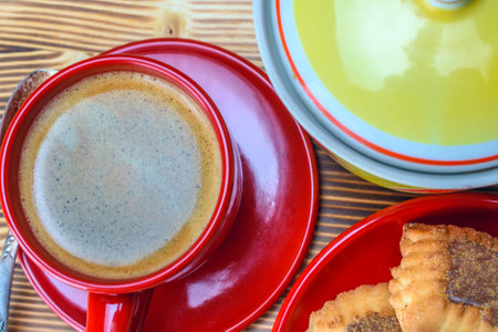Coffee and cookies on a wooden table. Top view.の写真素材