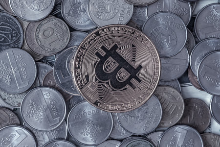 Close up of bitcoin coin on pile of coins. Cryptocurrency concept.の写真素材