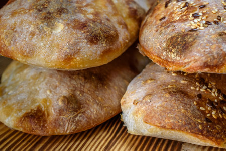 Close-up of freshly baked buns with sesame seeds.の写真素材