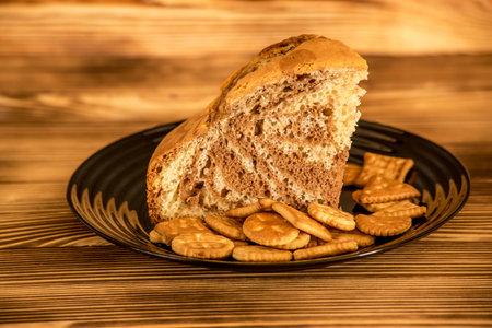 Sliced bread and crackers on wooden table. Toned.の写真素材