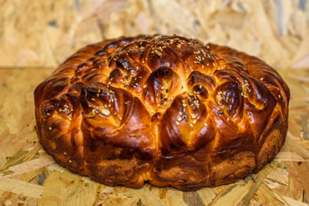 Bun with raisins on a wooden background. Close-up.の写真素材