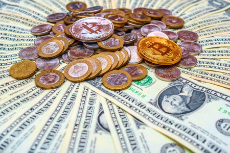 golden bitcoin on the background of dollar bills. close-upの写真素材