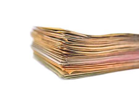 Pile of old magazines isolated on white background. Close up.の写真素材