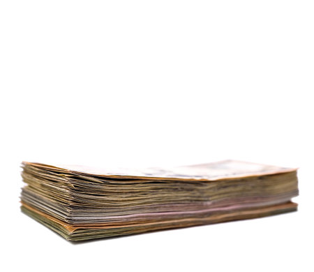 Pile of old money isolated on white background with clipping path.の写真素材