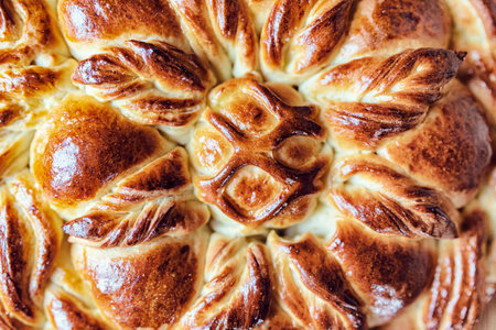 Homemade rustic twisted pie on a wooden background. Photographed close-up.