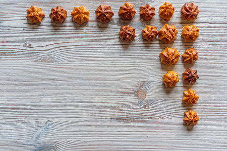 Choux pastry on a light wooden background. Photographed close-up.の写真素材
