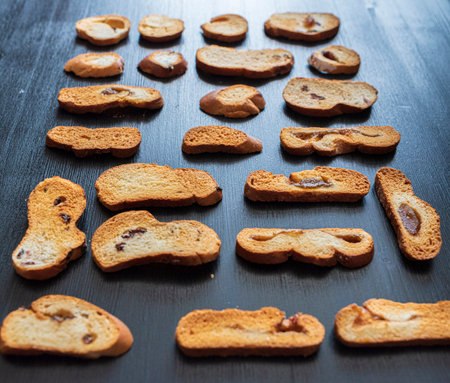 Wheat rusks on a wooden dark background.の写真素材