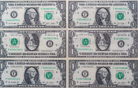 Six United States one dollar bills arranged in a grid pattern, showcasing the front side with George...