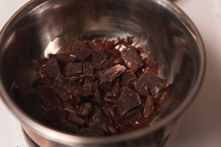 Chocolate handmade candies on a kitchen table making hot chocolate sweets in a mold