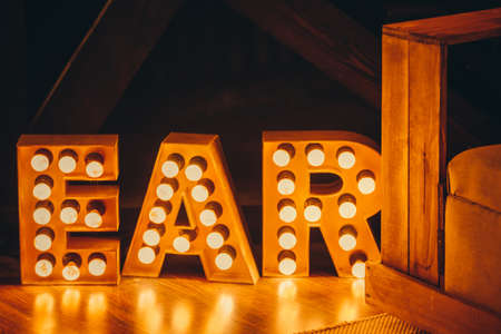 New Year 2021 Creative Design Concept letters from yellow bulbsの写真素材