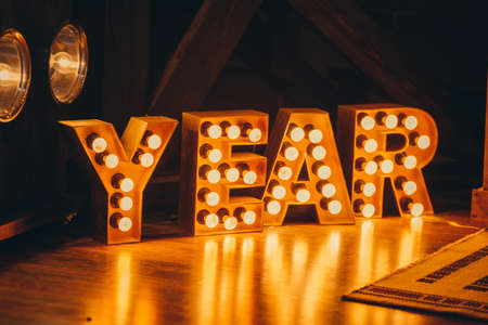 New Year 2021 Creative Design Concept letters from yellow bulbsの写真素材
