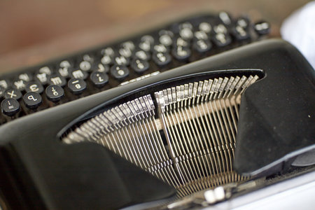 Vintage typewriter and a blank sheet of paper retouching retro blackの写真素材