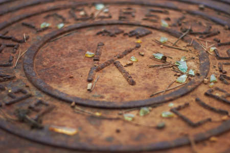 Rusty manhole cap grunge manhole cover with clipping path underground doorの写真素材