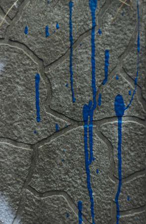 Texture of old gray with blue paint drip concrete wall for vintage background white